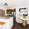 Open kitchen with island and stainless steel appliances located at The Reserve Apartments in Suffolk County, NY