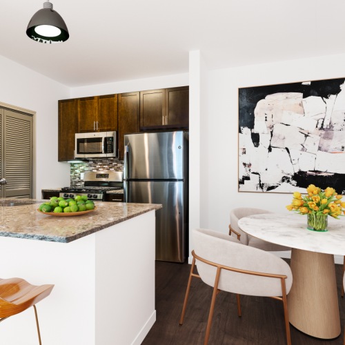 The Reserve Kitchen Open kitchen with island and stainless steel appliances located at The Reserve Apartments in Suffolk County, NY