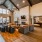Spacious and well lit clubhouse with bar seating and ample chairs for entertaining.