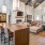 Spacious and well lit clubroom with large fireplace and access to the pool