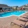 Large sparkling pool with sundecks and ample lounge chairs.