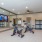 Large fitness center with cardio and weight lifting equipment.