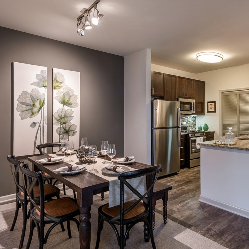 Dining Area  Spacious and well lit dining area with wood floors and access to the living room