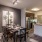 Spacious and well lit dining area with wood floors and access to the living room 