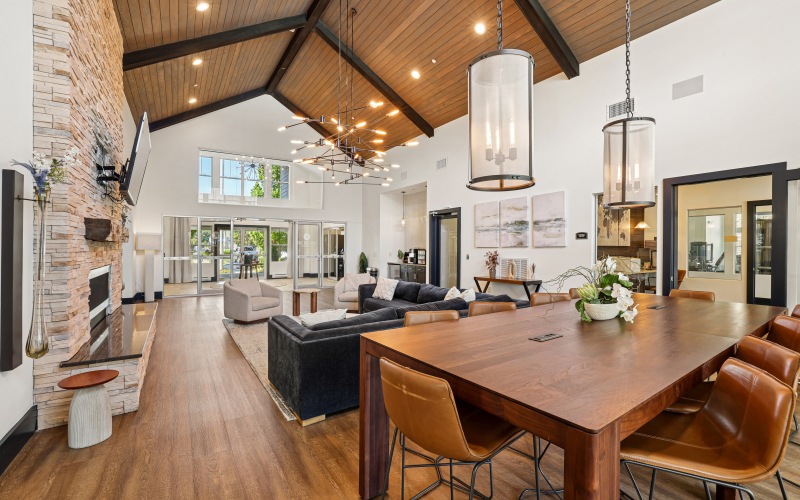 Lounge with table and couch with fireplace